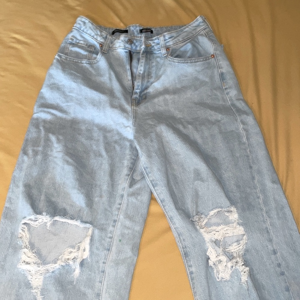 Ripped, Baggy, Blue Jeans.